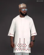 Men’s White Senator Native Wear with Multicolour Hem and Sleeve Embroidery plus Matching Hausa Cap – Elegant African Two-Piece - Image 2