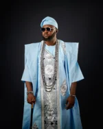 Royal Sky Blue African Men’s Agbada – Luxury Silver Embroidered Traditional Kaftan with Layered Beaded Necklace & Matching Fila Cap - Image 4